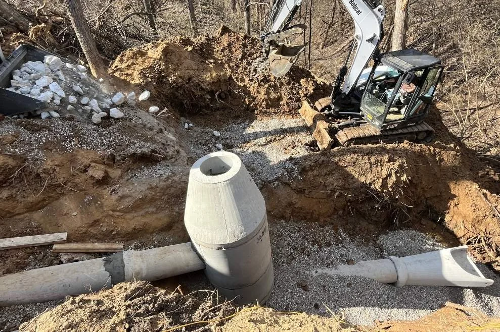 Drainage system installation with pipe and catch basin