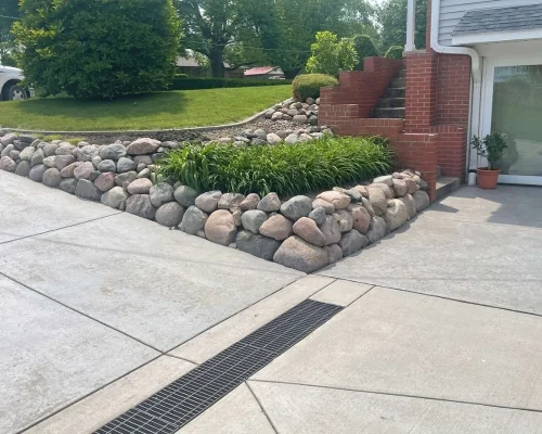 Clean landscape beds and stonework after seasonal cleanup