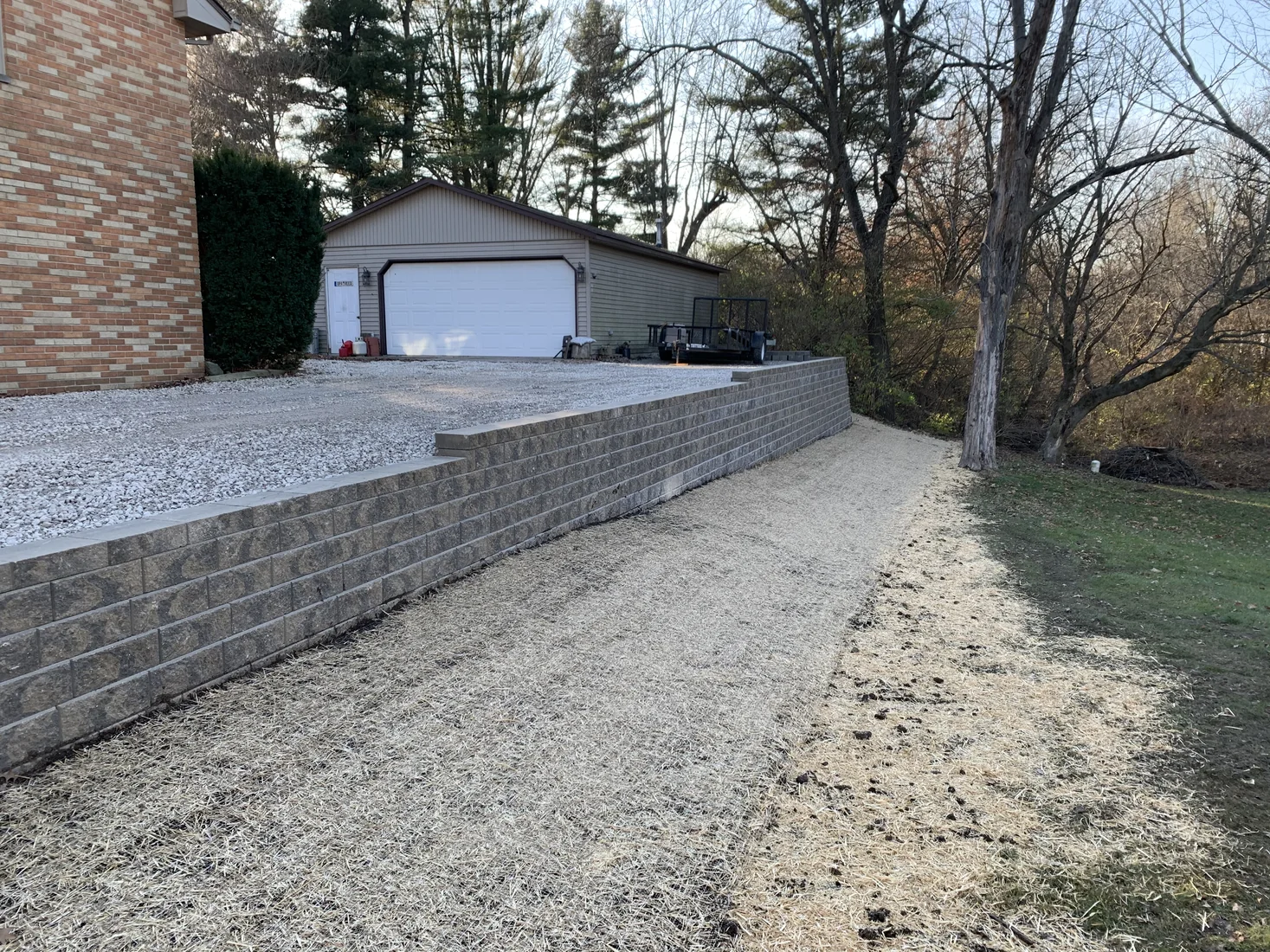 Retaining wall and driveway edge by Zehr Property Maintenance